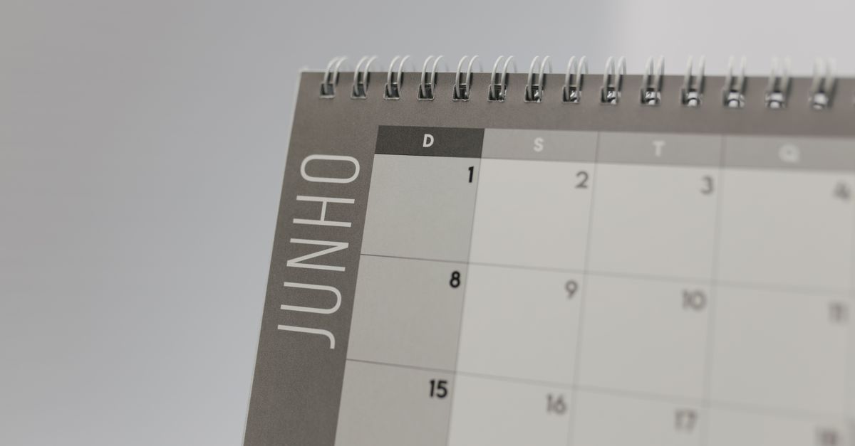 Close-up view of a spiral-bound calendar showing the month of June with a date grid.